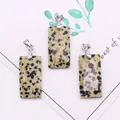 Macro view of rectangular Dalmatian Jasper stone pendants with silver metal clasps - 3-Pack / Dalmatian Jasper