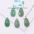 Macro detail of teardrop faceted green aventurine natural stone beads for jewelry making - 13x25mm / Green Aventurine