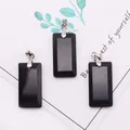Three rectangular matte black agate pendants with silver bails on a decorative card - 3-Pack / Black Agate