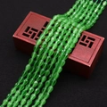 Green faceted teardrop cat eye stone beads for DIY jewelry making on a wooden box - No. 11 (Green)