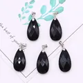 Set of five black faceted teardrop stone pendants with silver clasps on card - 13x25mm / Black Agate