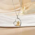 Macro view of heart pendant featuring a gold monkey and 'I Love You More' engraving - Golden Monkey (XL1087GA)