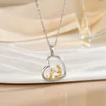 Silver and gold heart necklace featuring a girl and puppy silhouette with zircon inlay - Pet Companionship-Two Tone (XL1088GA)