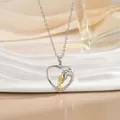 Detail of heart necklace showing a girl hugging a horse with diamond accents - Embracing Horse Head (XL1091GB)