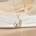 Luxurious heart-shaped necklace featuring girl, dog and rose relief in two-tone silver and rose gold - Girl and Dog Relief (XL1094GB)