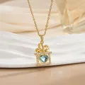 Detail of a 18k gold plated necklace featuring a blue heart gem in a gift box pendant - Blue Gemstone Gift Box Style (XL0685)