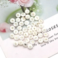 Flat round white freshwater shell beads with gold lightning bolt patterns for DIY jewelry - Lightning Print / 8mm 20 Pieces Per Pack