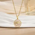 Detailed macro view of an 18k gold-plated sun and moon enamel pendant necklace - Sun Moon Star Disc Style (XL0689)