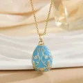 Sky blue enamel Russian egg pendant necklace with gold scroll patterns and crystals - Sky Blue
