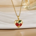Macro detail of a gold heart necklace with red cherry enamel and a fine O-chain link - Gold Heart Cherry Pattern Style (XL01183)