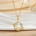 Detail of gold plated Saturn pendant necklace with blue beads and zircon crystals - Saturn Planet Theme Necklace (XL01299)