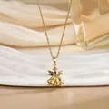 Détail du pendentif cloches de Noël dorées avec pierres précieuses colorées sur chaîne fine - Style Double Cloche en Pierres Colorées (XL01570)