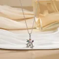 Détail du pendentif double cloche de Noël orné de cristaux de zircone multicolores - Style double cloche en zircone colorée (XL01570G)
