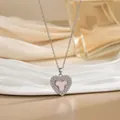 Detailed close-up of a silver heart necklace with pink stone inlay and zircon border - Silver Heart Pink Flower Style (XL01599G)