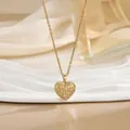 Elegant gold heart cage pendant necklace with inner white pearl and cubic zirconia accents - Hollow Cage Heart Pearl Style (XL01634)