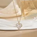 Close-up of heart pendant necklace with pink stones and sparkling gold chain details - Gold Heart Enamel Rhinestone Style (XL01661)