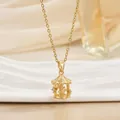 Detailed close-up of a gold merry-go-round pendant necklace with sparkling zircon accents - Carousel Horse (XL01478)