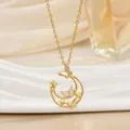 Detailed close-up of a gold-plated moon and butterfly pendant with sparkling zircons - Butterfly Moon And Star (XL01479)