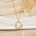 Detailed close-up of golden heart pendant with stars and celestial zircon elements - Planet With Ring (XL01480)