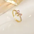 Elegant gold bow open ring with pink zircon heart stones and sparkling micro-pave crystals - Rhinestone Row Bowknot Design (XL0326)