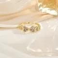 Bague ajustable cœur doré avec zircons violets au design minimaliste et élégant - Style Creux Cœur Violet (JZ0329)