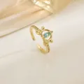 Gold crown open ring featuring a blue marquise gemstone and white cubic zirconia accents - Vintage Crown Light Blue Stone (XL0338)
