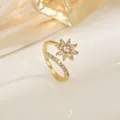 Elegant adjustable flower zircon open ring with gold plated finish on champagne satin - Eight-Petal Flower Bypass Ring (XL0340)