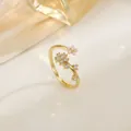 Detail view of gold floral ring with pink enamel petals and white cubic zirconia accents - Pink Enamel Pastoral Floral (XL0345)