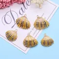 Set of 5 gold-plated shell pendants with realistic ribbed texture on blue background - Golden Yellow (No.6)