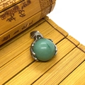 Green crystal ball pendant with silver claw setting and small diamonds on bamboo background - 19x28mm / Green Aventurine