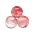 Detailed macro view of three pink round cabochon natural stones with internal texture - 4mm / Watermelon Quartz