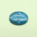 Polished oval blue tiger eye stone cabochon with natural marble texture on green surface - Blue Crazy Agate / 30x40mm, 13g