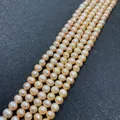 Vue détaillée d'un rang de perles d'eau douce roses de qualité AA pour bijoux - 12-13mm / Rose