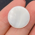 Hand holding 10mm white mother of pearl round shell bead with natural iridescence - No Holes (100 Pieces/pack) / 10mm 0.2g/pc