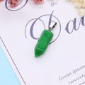 Detailed view of green stone hexagonal pendant with silver clasp on decorative background - 9x28mm / Green Jade