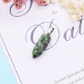 Detailed view of Ruby in Zoisite hexagonal bullet pendant with silver metallic clasp - 9x28mm / Ruby Zoisite