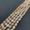 Macro detail of natural freshwater baroque pearls in pink-orange with iridescent luster - 5-6mm 10g / Pink