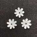 White flower shell beads for DIY jewelry making displayed on a black background - Eight-petal Rounded Flower Style (Style 18 10mm)