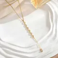 Elegant gold long tassel necklace featuring sun star moon zircon pendants on a silk background - Vertical Mini Pave Rings Style (XL01924)
