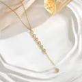 Macro detail of gold Y-shaped necklace with zircon heart charms and silk background - Six Pave Heart Charm Style (XL01926)