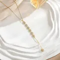 Detail shot of golden Y-shaped tassel necklace with micro-paved cubic zirconia squares - Pave Square Vertical Bar Style (XL01928)