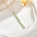 Detail of elegant gold necklace with six light blue enamel flowers on a silk backdrop - Six Light Blue Enamel Flower Style (XL01932)