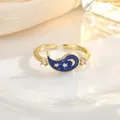 Detail view of gold butterfly heart ring with blue enamel moon and star pattern - Blue Star Moon Enamel Style (JZ0431)