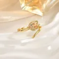 Macro shot of a gold tulip ring featuring champagne stones and sparkling zircon details - Champagne Tulip Style (JZ0471C)