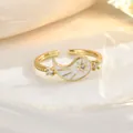 Detail of adjustable gold ring with white enamel sunburst pattern and tiny diamonds - Gold Sunburst Pattern Style (JZ0432)