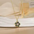 Macro detail of rotating flower pendant with green stripes and zircons on gold necklace - Five-Petal Green Flower Style (XL02154)