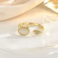 Detailed close-up of a gold-plated cat and fish open ring with cat's eye stone - Gold Cat and Fish Style (JZ0437)