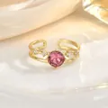 Detailed close-up of a pink gemstone heart ring with gold band and small diamond accents - Gold Pink Main Stone Vintage Style (JZ0438)