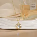 Detail of rotating gold flower pendant with iridescent stone and crystals on necklace - Iridescent Gem Round Floral Style (XL02164)