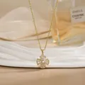 Detailed close-up of a rotating flower pendant necklace with white zircons on silk - Radiating Cross Pattern Style (XL02166)